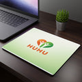 Rectangular desk mouse pad with green gradient HUHU heart logo - wellness office accessory