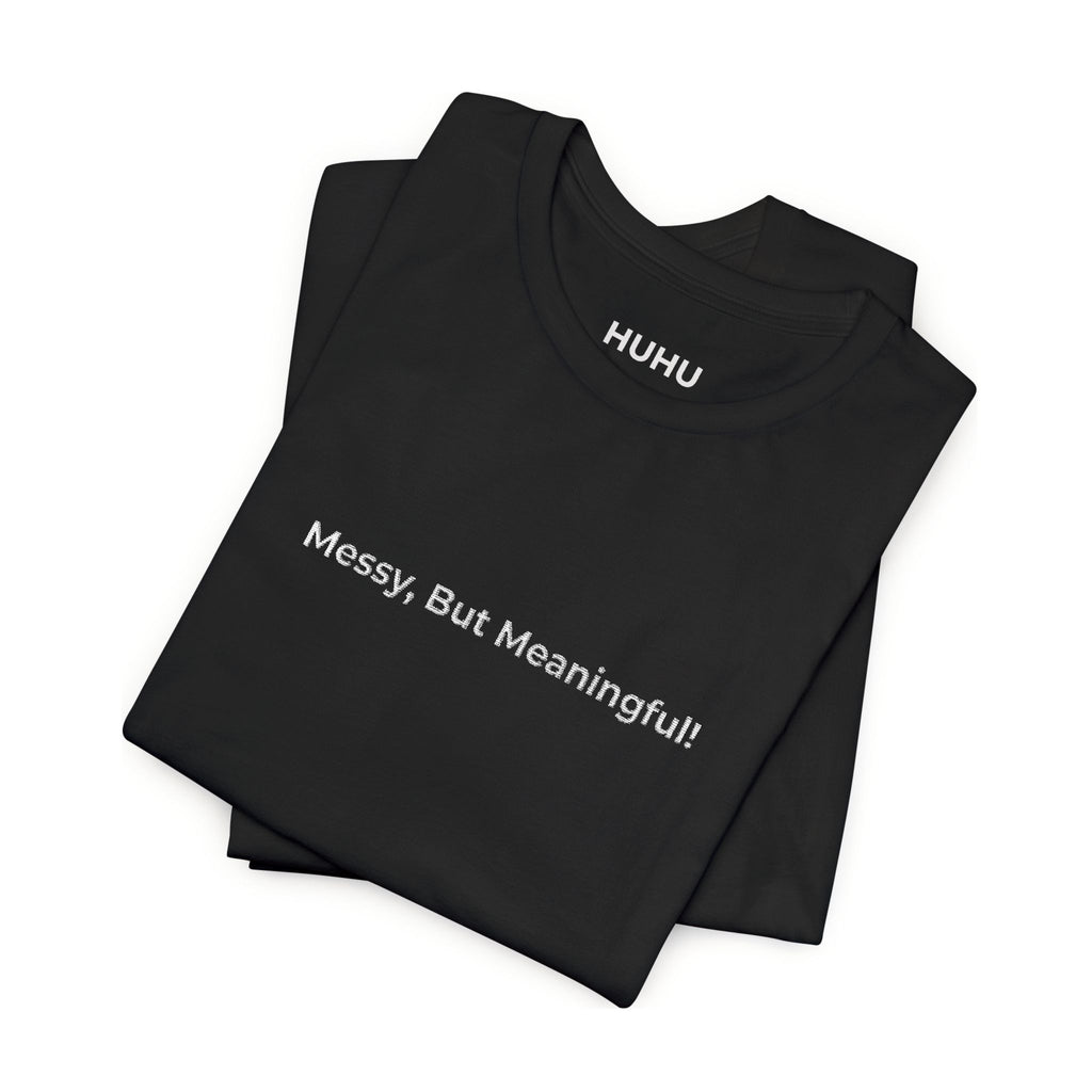 Minimalist white t-shirt with Messy But Meaningful text - authentic living wellness message tee